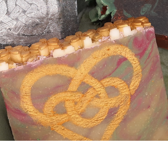 Decorative soap with gold design and pinkish background