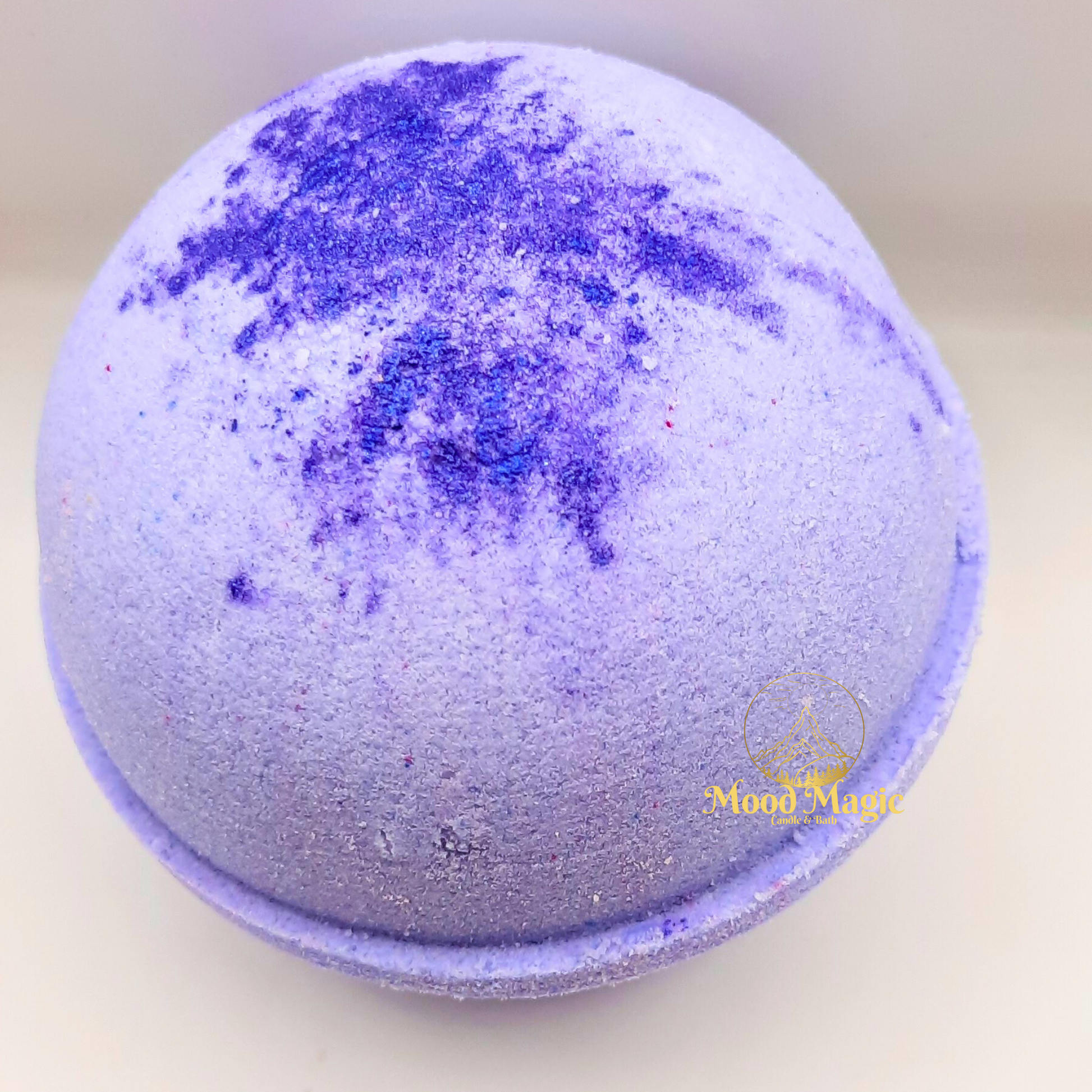 Winter Fairy Hemp Oil Bath Bomb tinted purple with a splash of purple blue micha